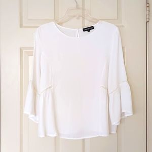 100% Rayon Blouse with wide bottom, sleeves and lace designs.